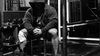 Hooded strength athlete seated in a gym for the Boring But Big 5/3/1 program