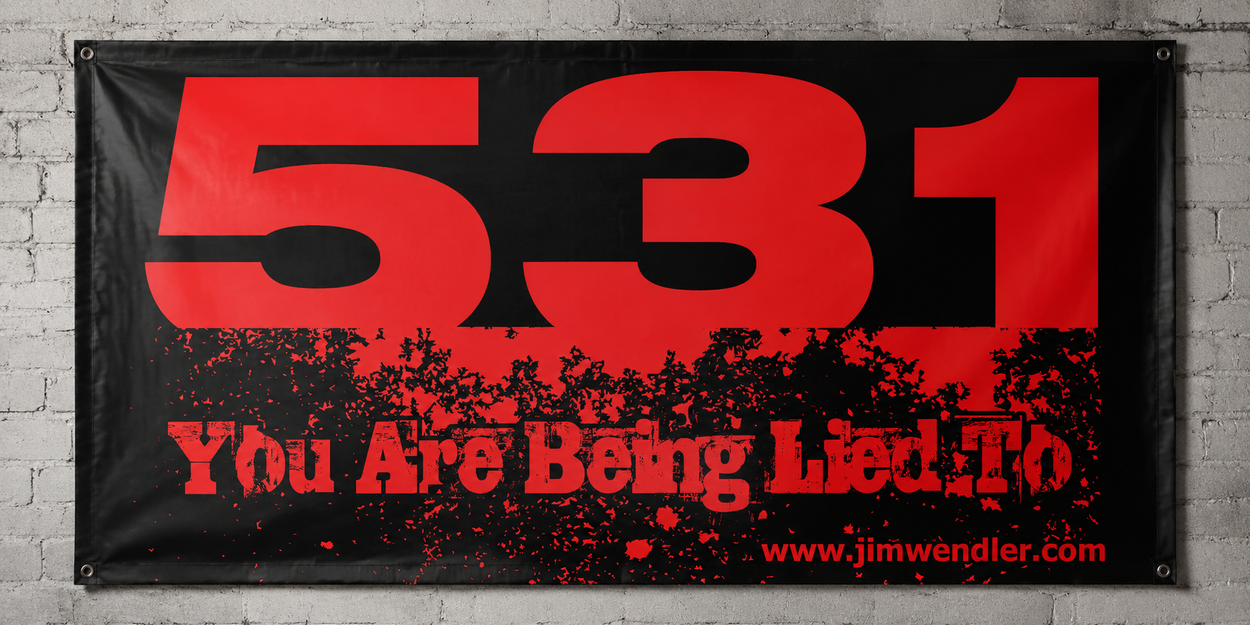 Red and black 5/3/1 You Are Being Lied To vinyl banner mounted on a light grey brick wall.