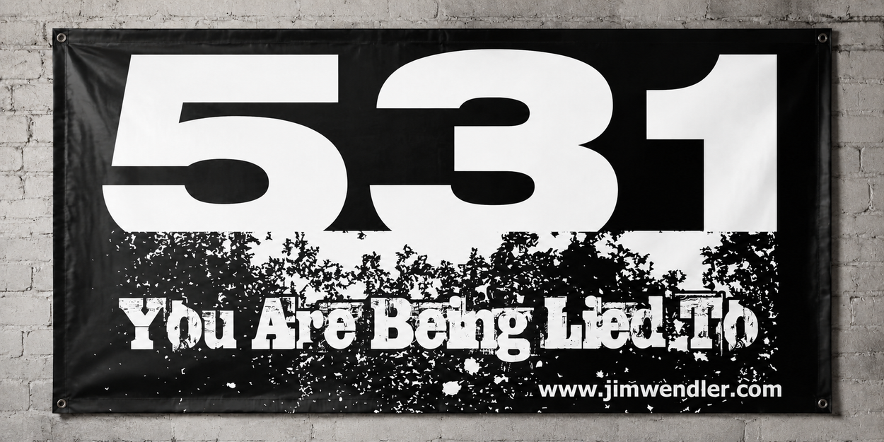 White and black 5/3/1 You Are Being Lied To vinyl banner mounted on a light grey brick wall.