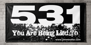White and black 5/3/1 You Are Being Lied To vinyl banner mounted on a light grey brick wall.