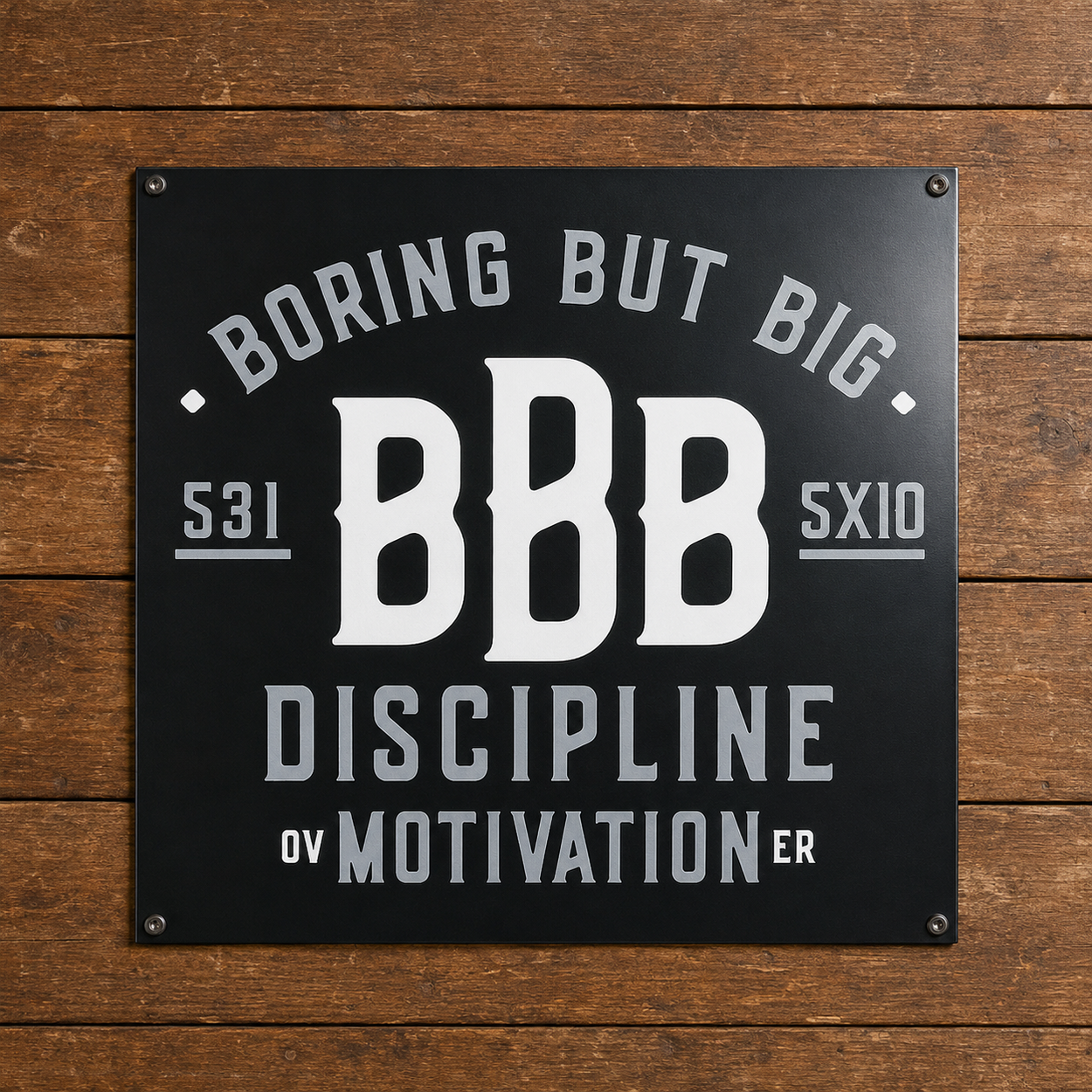 Black Boring But Big aluminum wall sign featuring “Discipline Over Motivation” on a wood background.