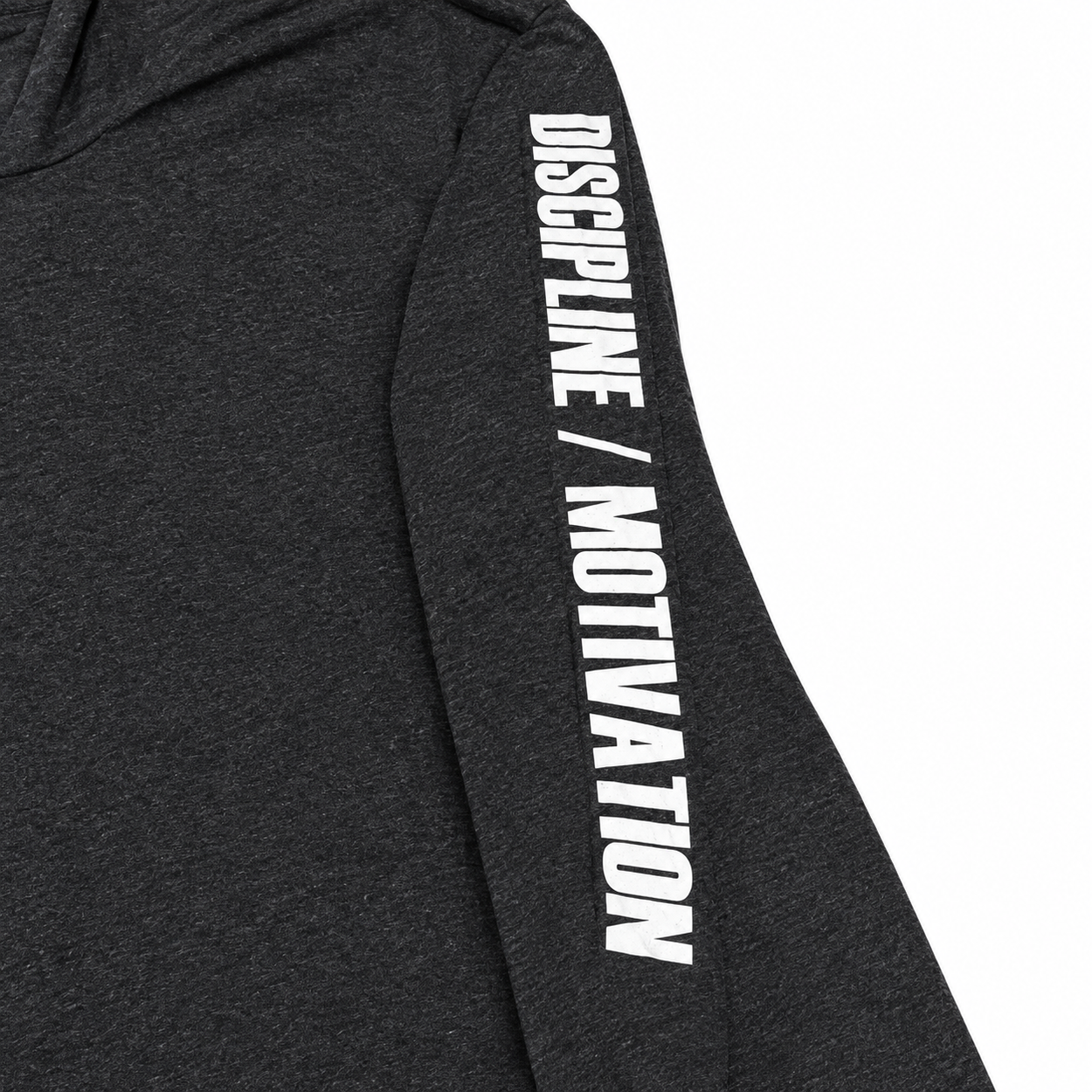 Close-up of white Discipline Over Motivation print on the heathered black shirt sleeve
