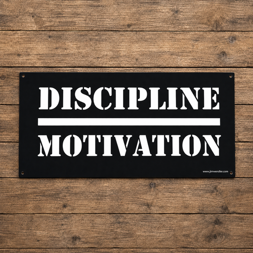 Black Discipline Over Motivation wall sign with white stencil lettering on a wood background.