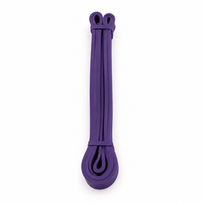 Folded purple individual resistance band on a white background.