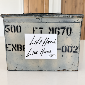 Jim Wendler Lift Hard, Live Hard magnet displayed on a weathered metal box.