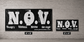 N.O.V. gym banners in 4' × 8' and 2' × 4' sizes displayed on a light brick wall for scale comparison.