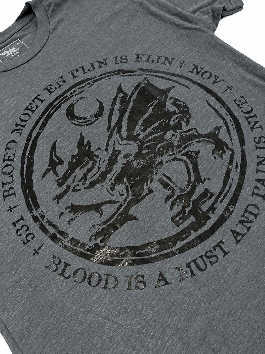 Close-up of the black dragon design on the grey Pain Is Nice shirt by Jim Wendler.
