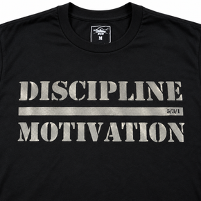Close-up of the Discipline Over Motivation design reflecting silver on a black shirt