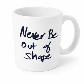 Reverse side of the white Stretch Lift Sprint mug featuring the handwritten phrase “Never Be Out of Shape” in black.
